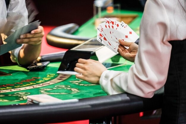 mayong77 login Casino Hold'em live dealer table with professional dealer and community cards displayed