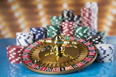 mayong77 login dealer revealing community cards during Casino Hold'em flop